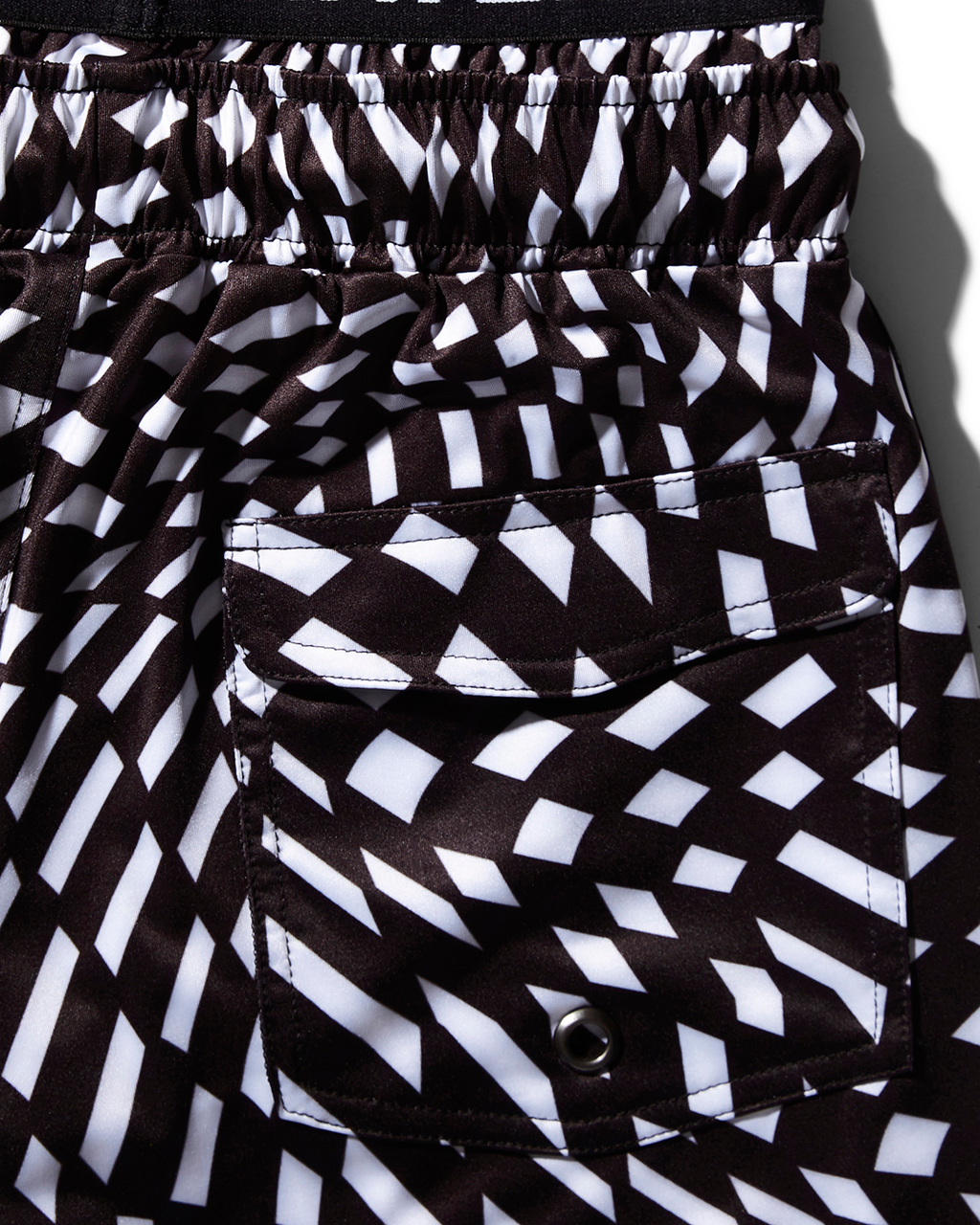 KIDS TRIPPY SWIM TRUNKS